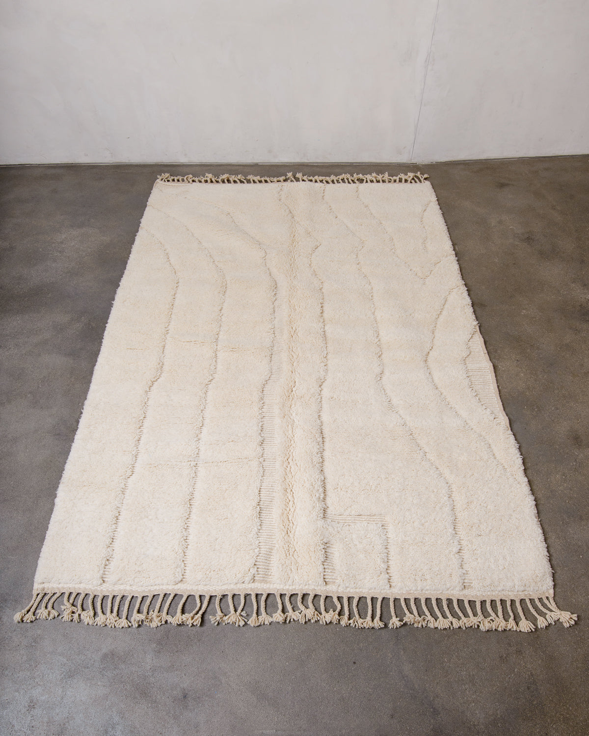 Modern, designer, handcrafted Berber rug from Morocco. Beniourain carpet with minimalist design, natural wool pile and a fluffy texture.